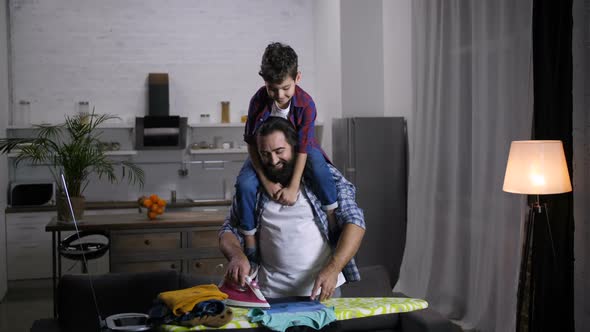 Joyful Family Doing Household Chores Together