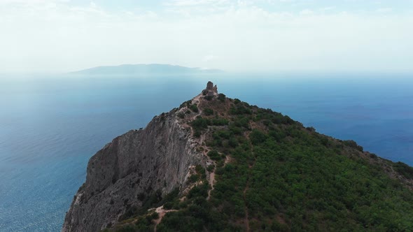 Aerial View of Ancient and Medieval Building on the Top of Mountainrocky Coastline with Green