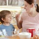 Little Boy with Mother Pouring Cream and Sugar in Bowl for Baking Cake - VideoHive Item for Sale