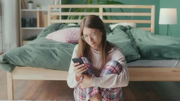 Stressed Nervous Young Woman Looking at Cellphone Screen Feeling Frustrated