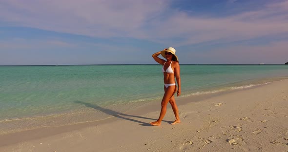 Modern Fun Woman Traveling Spending Quality Time on The Beach on Summer White Sand and Blue