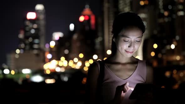 Woman Using Smart Phone at Night 