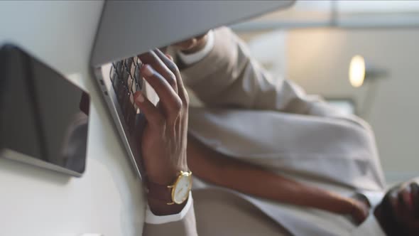 Close Up of Afro-American Businessman Typing on Laptop