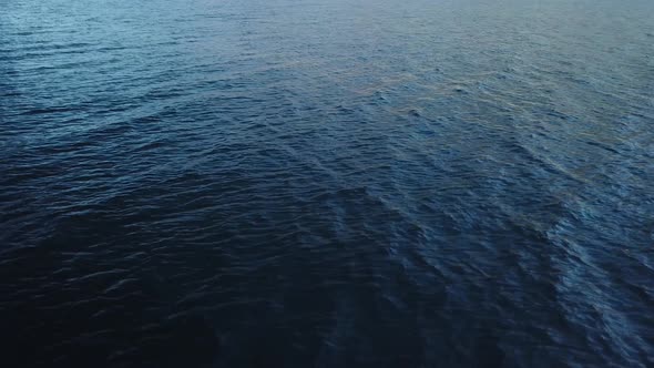 Waves generated by the wind on dark blue water surface. Lake Walen, Switzerland