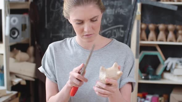 Woman Filling Papier-Mache Figure