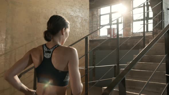 Run. Runner woman running up stairs, training indoors