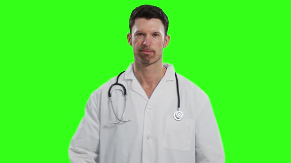 Caucasian male doctor on green screen background