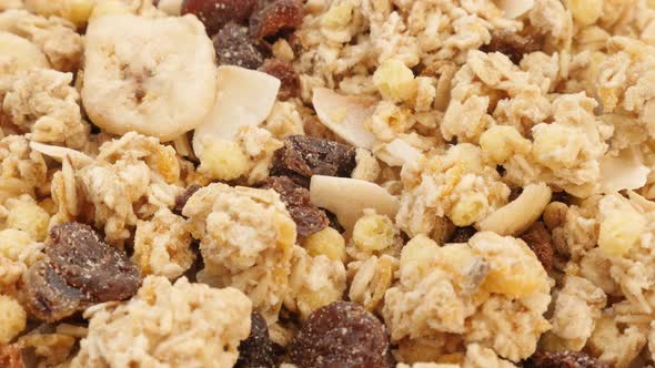 Raisins and  other dried fruits in muesli crunch mix food background 4K 3840X2160 UltraHD tilting fo