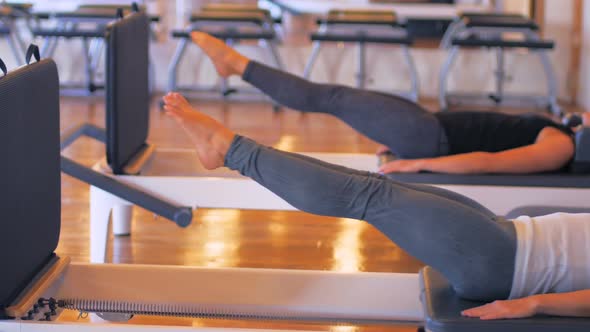 Women exercising on gym equipment