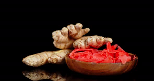 Pickled Ginger on the Plate and Fresh Ginger Slowly Rotate. 