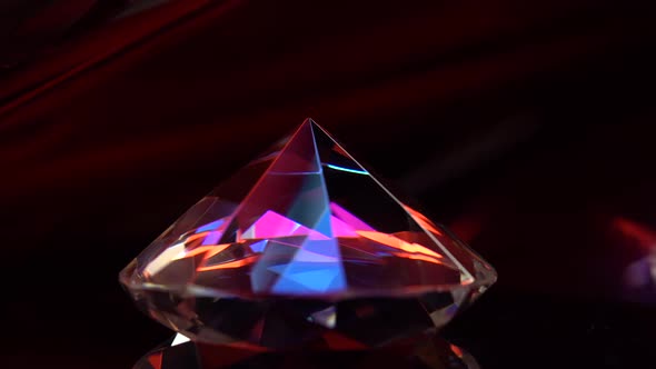 Diamond Rotating on a Surface and Flickering in Rays of Light