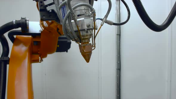 Robotic laser head for metalworking in engineering laboratory