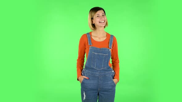 Lovely Girl Smiles Broadly and Winks. Green Screen
