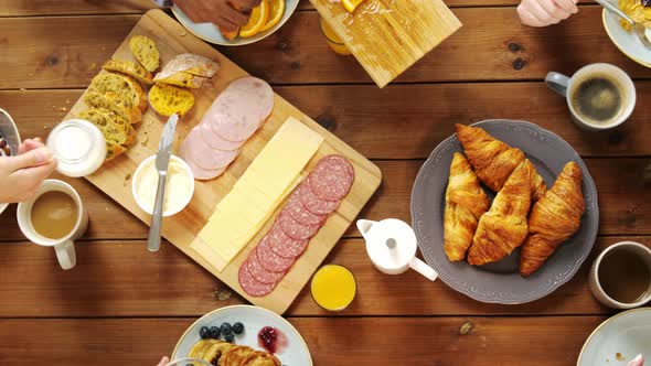 Group of People Eating at Table with Food 5