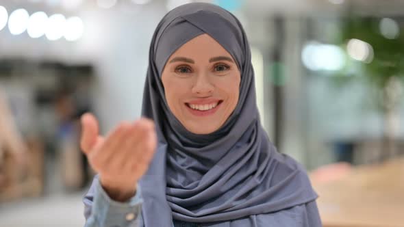 Serious Arab Woman Pointing at the Camera