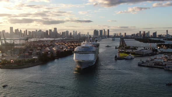 Huge cruise ship leaving Port of Miami at sunset, USA