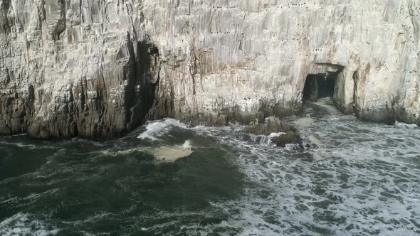 Sheer Limestone Cliffs Of Piedra de la Iglesia In Southern Chile. Aerial Slide Shot