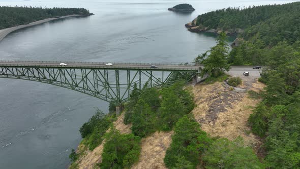 Wide aerial shot of Whidbey, Pass, and Fidalgo Islands all united by the Deception Pass bridge.