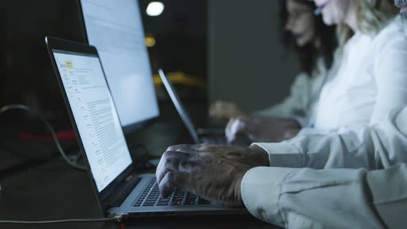 Cropped Short of Teleworkers Using Laptops