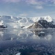 POV WS Snow covered mountains and ice floes in water at Neko Harbor / Antarctic Peninsula, Antarctic - VideoHive Item for Sale
