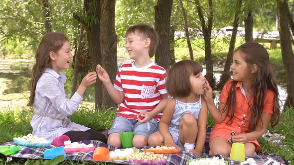 Group of Happy Children Playing Outdoors in Summer Park