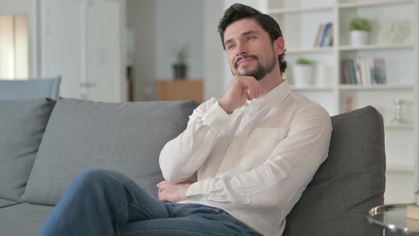 Pensive Man Thinking at Home