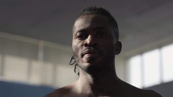 Closeup of Handsome Confident African American Sportsman Looking at Camera with Sunlight on Face