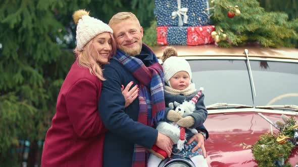 Family on the Background of a Retro Car