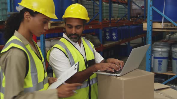 Workers interacting in a warehouse