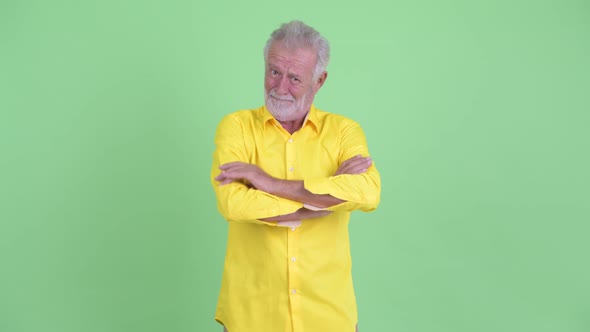 Happy Senior Bearded Businessman Smiling with Arms Crossed