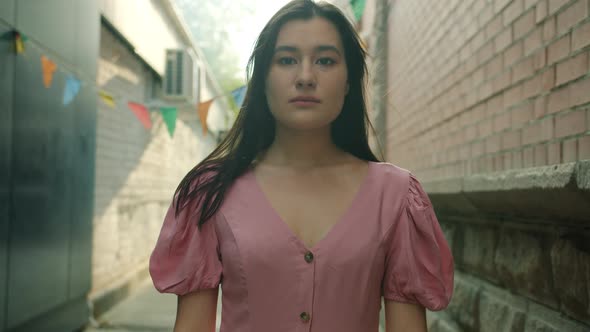 Slow Motion Portrait of Unhappy Mixed Race Lady Showing Thumbsdown Hand Gesture Standing Outside