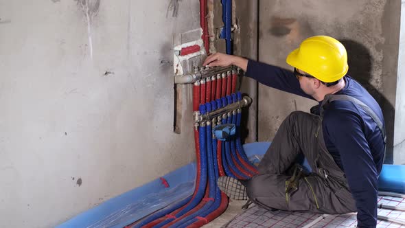 Plumber Man Working with a Wrench in His Hands