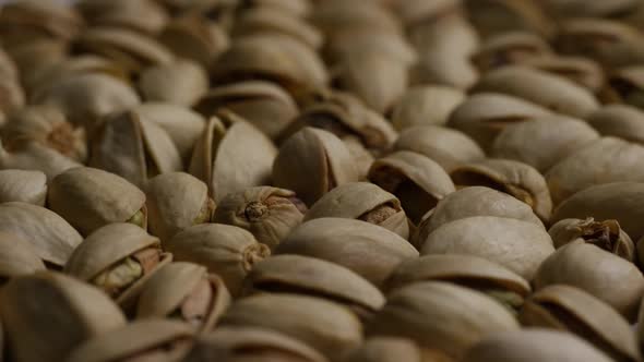 Cinematic, rotating shot of pistachios on a white surface - PISTACHIOS 023