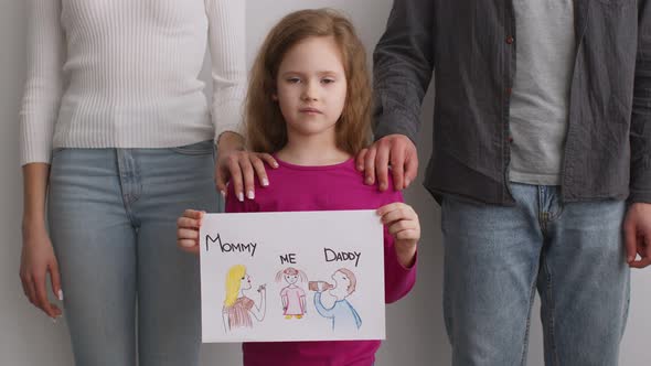 Unhappy Little Girl Holding Picture with Father Alcoholic and Glamorous Mother Ignoring Kid Feeling