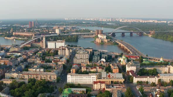 Top view of Podol. Many buildings and churches. Evening view of the river Dnipro.