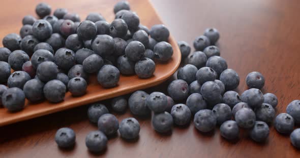 Stack of blueberry on the wooden plate