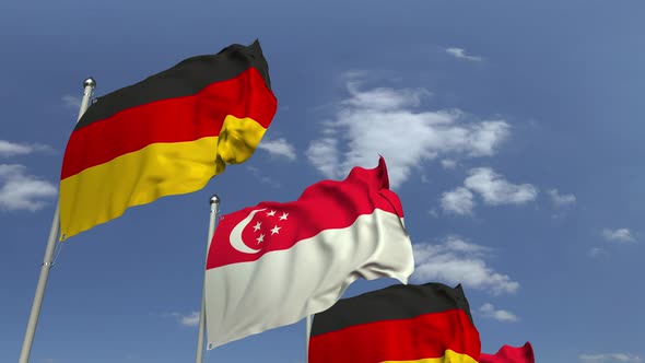 Waving Flags of Singapore and Germany