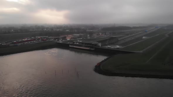 Noord River With A15 Motorway Next To Waste Collection Stations In Hendrik-Ido-Ambacht On A Gloomy D