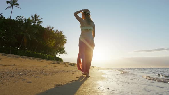 Woman in Beautiful Waving Dress on Summer Vacation on Tropical Hawaii Island USA