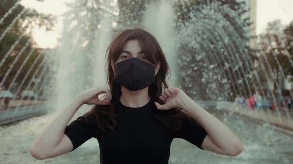 Woman is wearing face protective mask