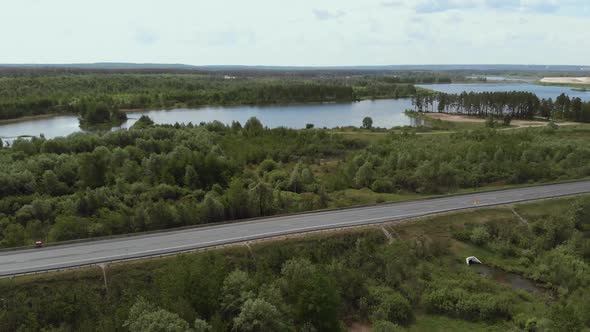 Aerial View of White Truck Passing Busy Highway