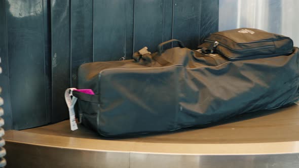 Luggage of Passengers Is Moved Along the Transport Belt