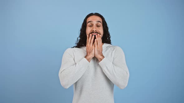 Emotional Happy Guy Screaming WOW Opening Mouth in Amazement Blue Studio Background