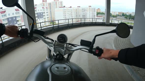 First Person View of Turning on Corners on Motorbike at the Multilevel Parking