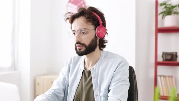 Successful Hipster Freelancer Working on Computer While Staying at Home