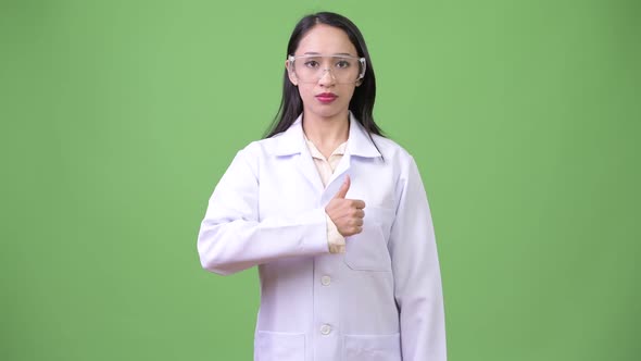 Young Beautiful Asian Woman Doctor Wearing Protective Glasses