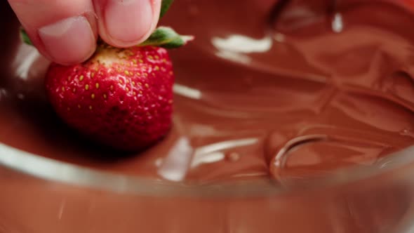 Strawberry in Melted Chocolate Closeup Melting Chocolate Bar for Fondue