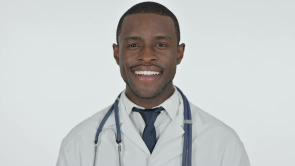 African Doctor Smiling at Camera White Background