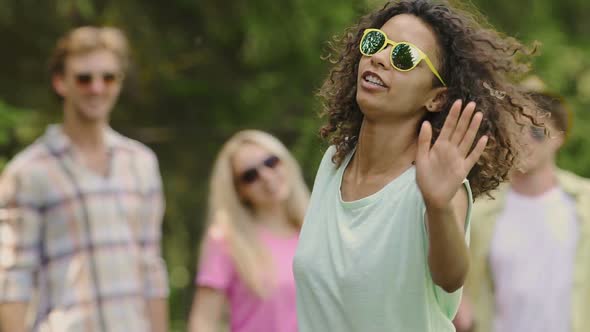 Confident Mixed Race Girl Shaking Head, Actively Dancing at Talent Show, Slow-Mo