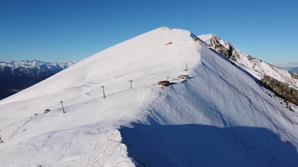 Flying over the snowy Mountains in the Winter